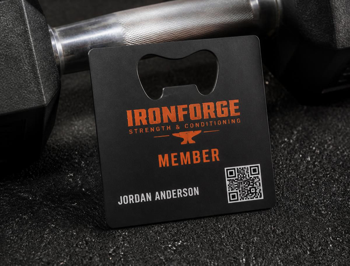 bold black and orange gym membership metal card with QR code for class booking
